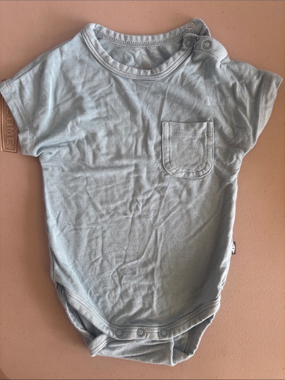 Kyte Baby Dusty Blue Crew Neck Bodysuit with Pocket. Like New. 0-3 mos.
